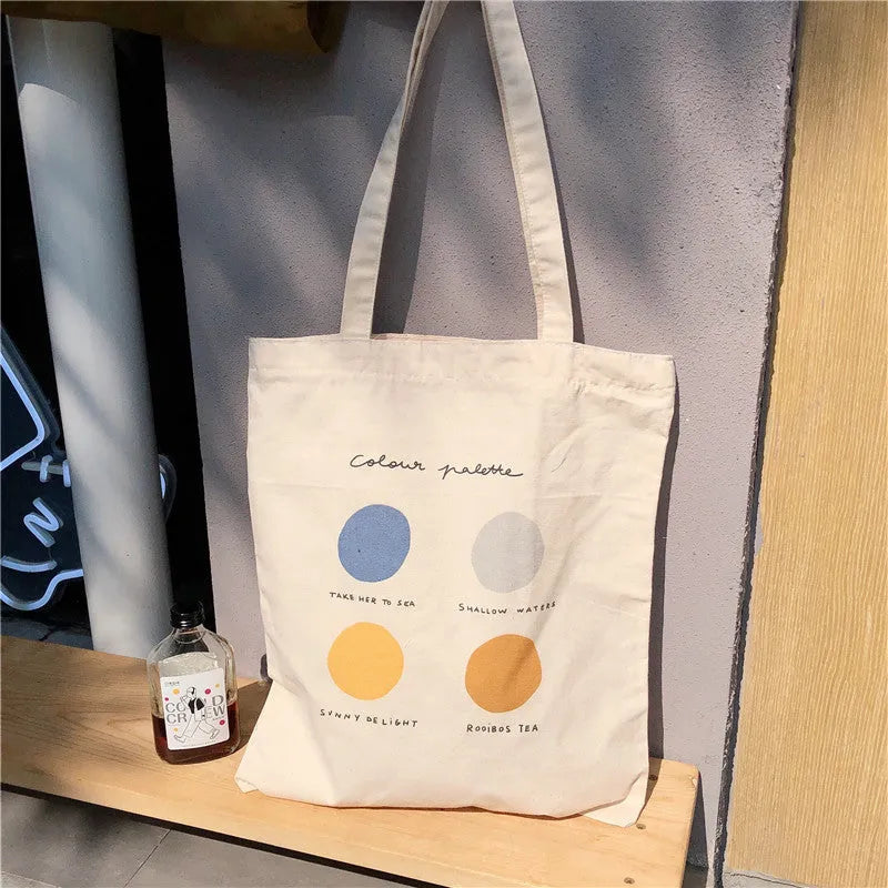Women's medium canvas tote bag with geometric print, zipper closure, and soft handles in light pink colour