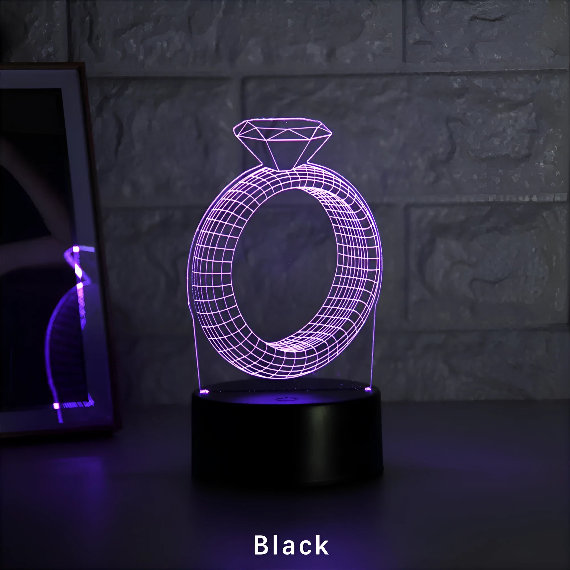 3D LED night light showing illuminated diamond ring design on a black background with colour-changing lights.