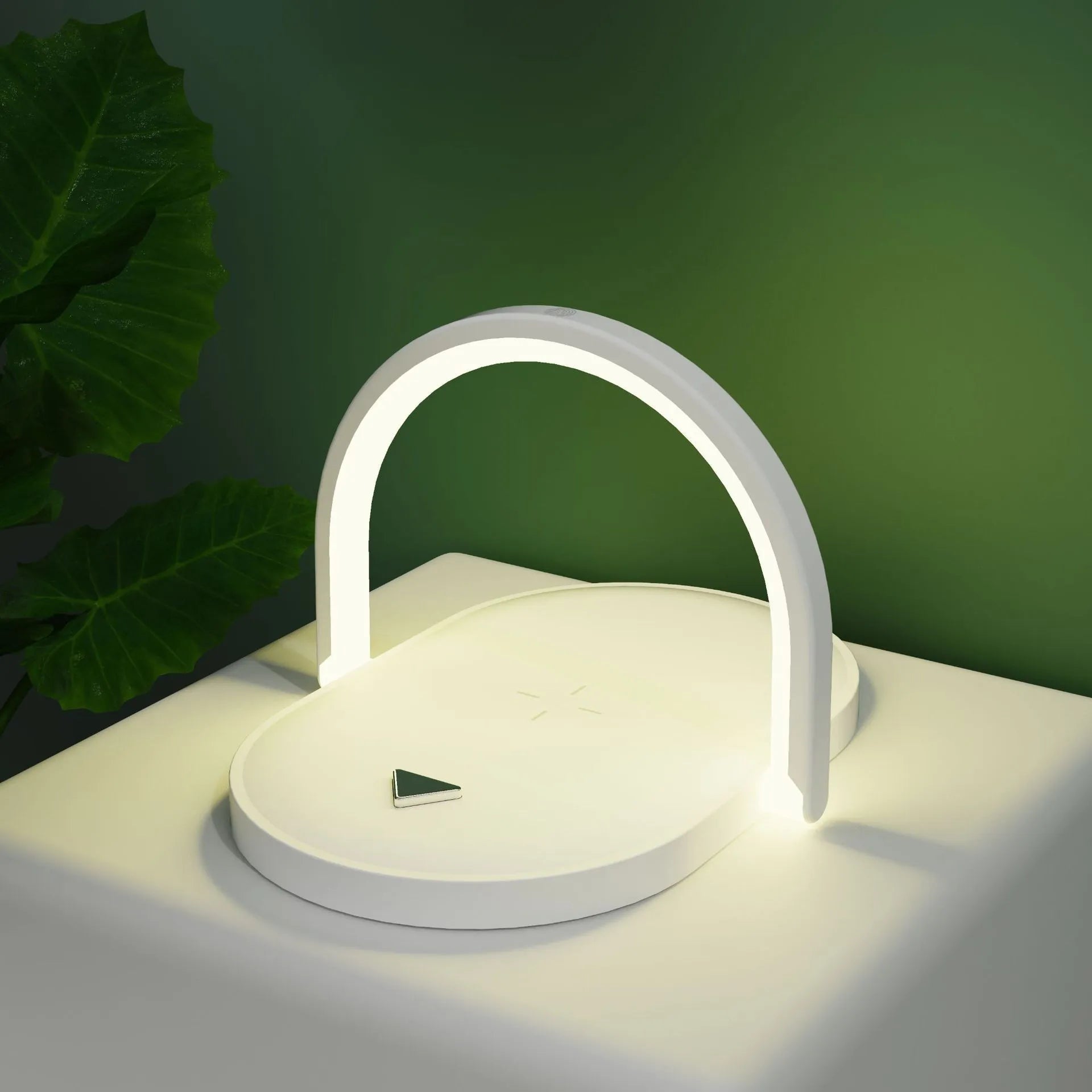 Black 15W wireless charger night light with phone holder on a wooden desk