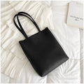 Large-capacity portable tote bag in Black with plain car suture design, soft handle, and single shoulder strap