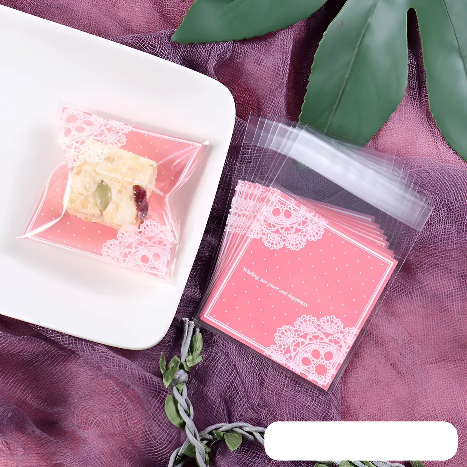 Pink plastic self-adhesive packaging bags for handmade soap and snacks, showing the adhesive seal.