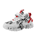 Kids blue and beige Velcro sports sneakers with rubber sole shown from side