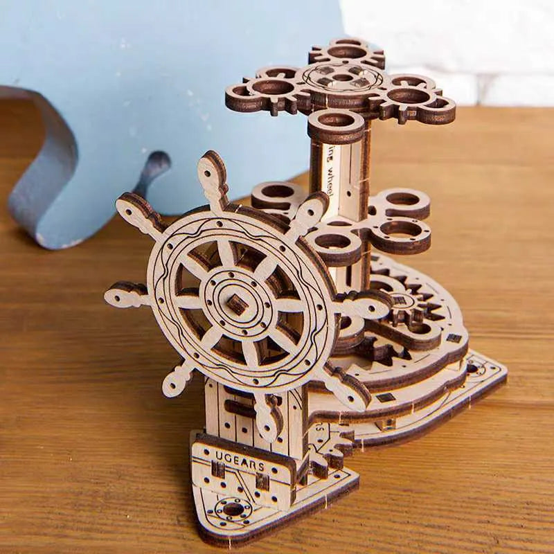 Wooden rotating pen holder with steering wheel mechanism showing photo colour finish on machinery model