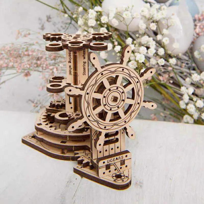 Wooden rotating pen holder with steering wheel mechanism showing photo colour finish on machinery model