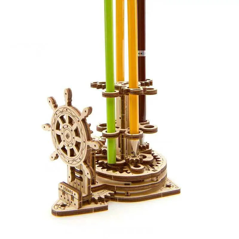 Wooden rotating pen holder with steering wheel mechanism showing photo colour finish on machinery model