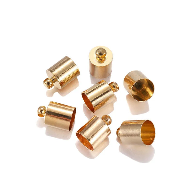 Assorted copper caps for jewellery making in gold, silver, bronze and black finishes, showing size variation.