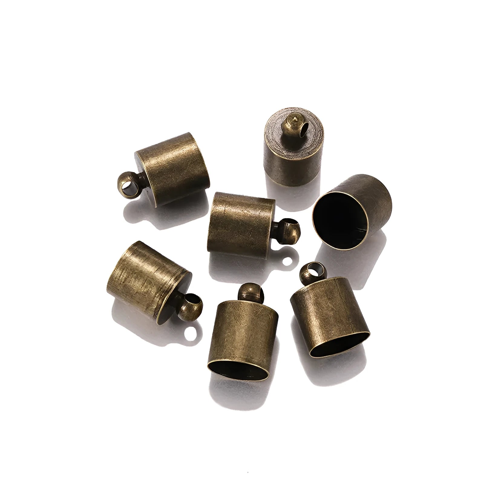 Assorted copper caps for jewellery making in gold, silver, bronze and black finishes, showing size variation.