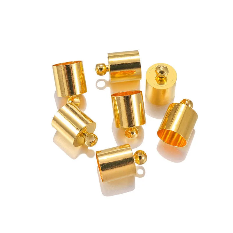 Assorted copper caps for jewellery making in gold, silver, bronze and black finishes, showing size variation.