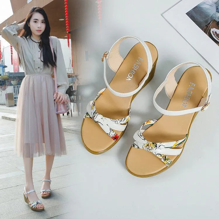 Pink women's wedge sandals with a fish mouth design and buckle strap on a non-slip sole.