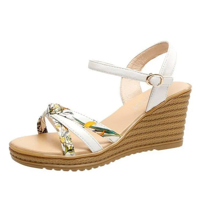 Pink women's wedge sandals with a fish mouth design and buckle strap on a non-slip sole.