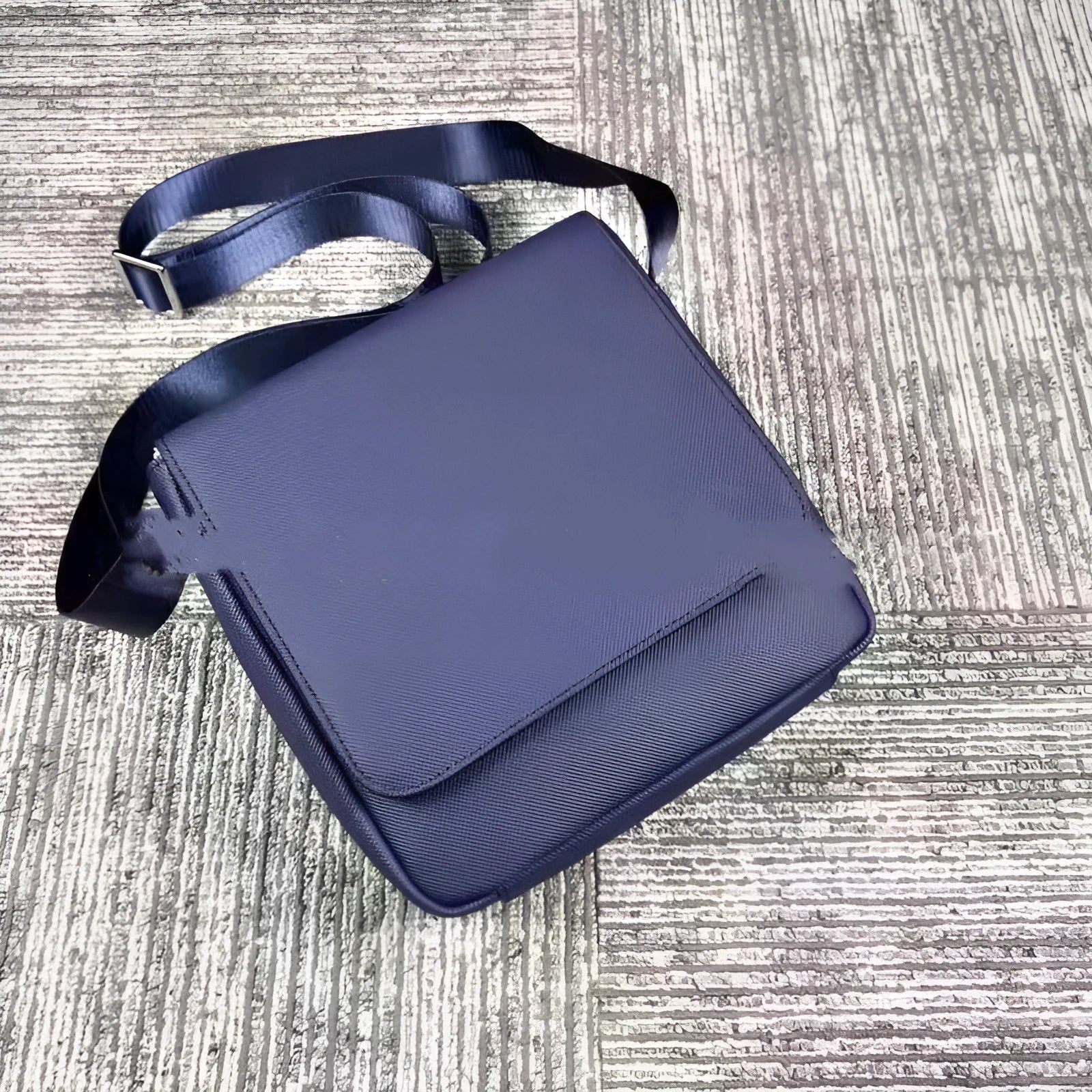 Men's leather horizontal square backpack in black with cover opening and internal organiser pockets