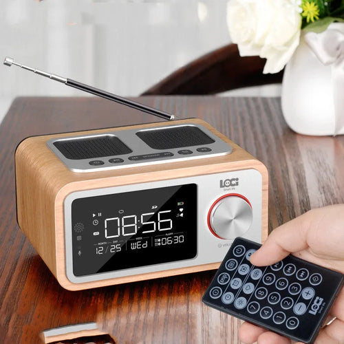 Compact wooden Bluetooth speaker alarm clock radio in golden oil colour with dual drivers and USB charge port