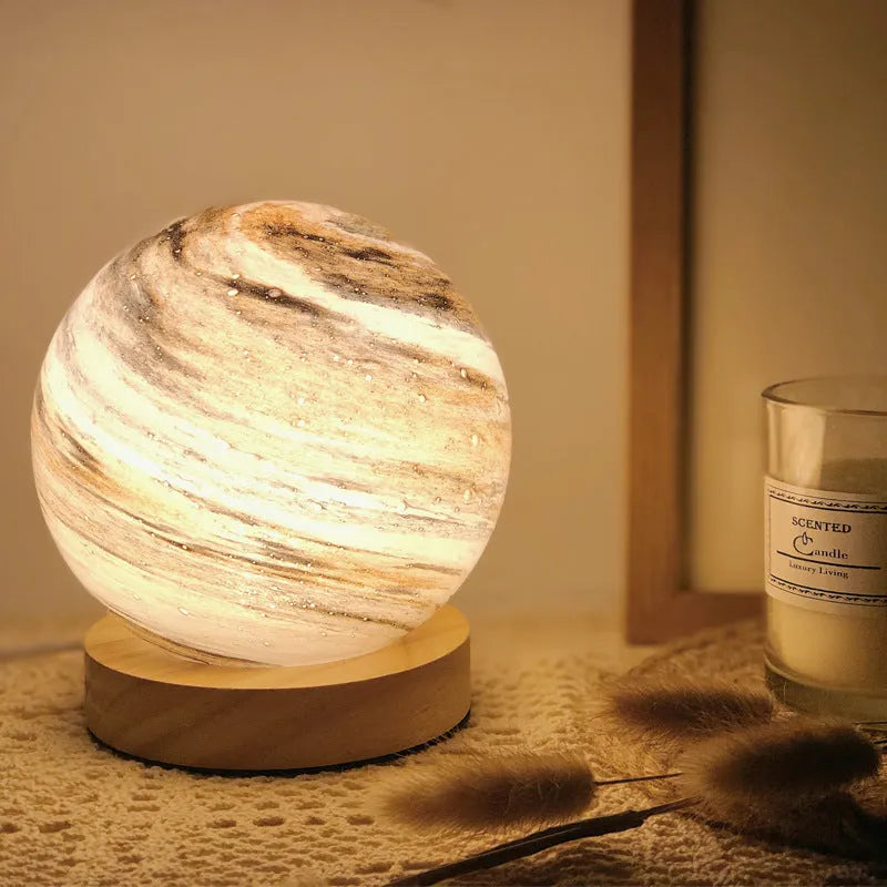 Nordic style USB-powered bedside table lamp with a glass shade, shown in one of seven available colours.
