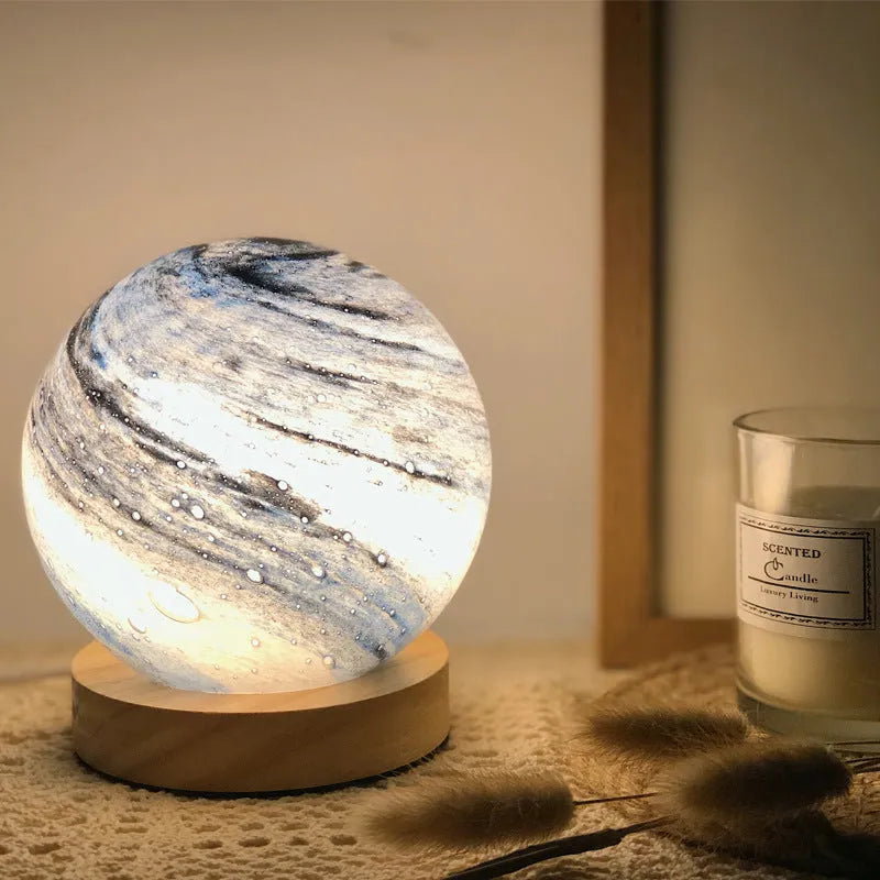 Nordic style USB-powered bedside table lamp with a glass shade, shown in one of seven available colours.