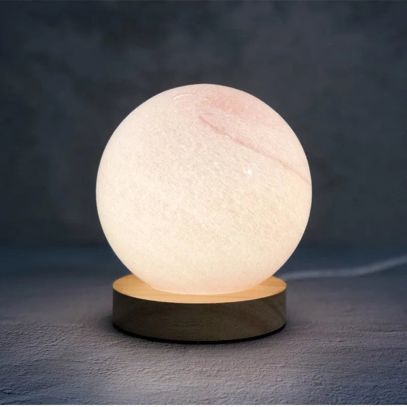 Nordic style USB-powered bedside table lamp with a glass shade, shown in one of seven available colours.