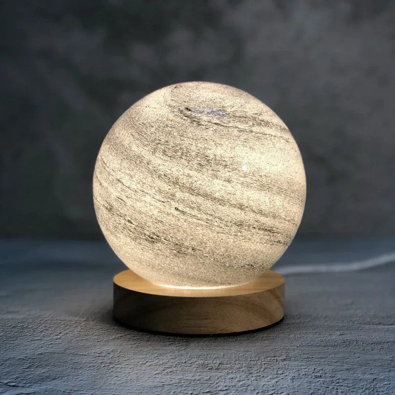 Nordic style USB-powered bedside table lamp with a glass shade, shown in one of seven available colours.