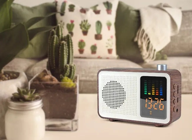Brown wooden retro Bluetooth radio speaker with a large tuning dial on the front.