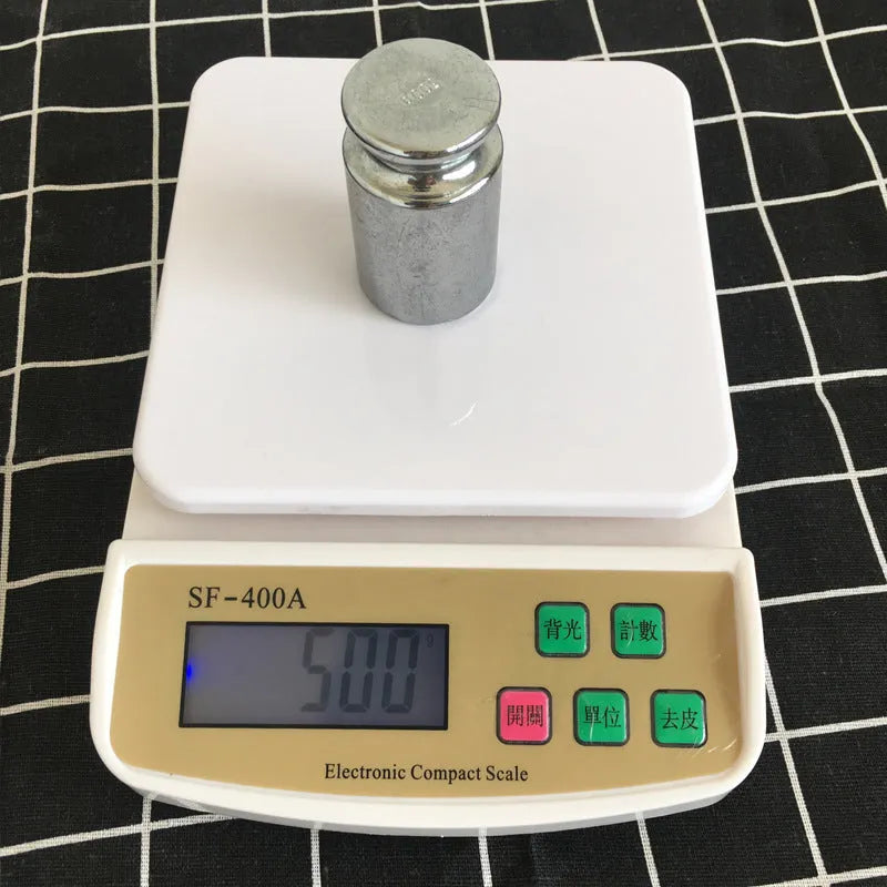 Electronic kitchen scale with digital display showing weight measurement