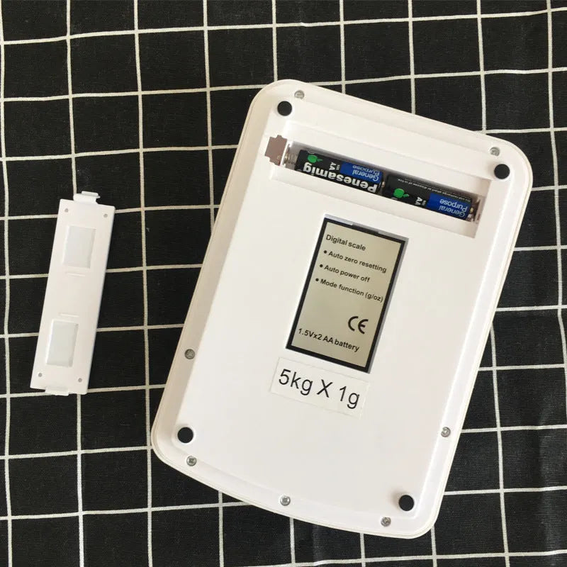 Electronic kitchen scale with digital display showing weight measurement