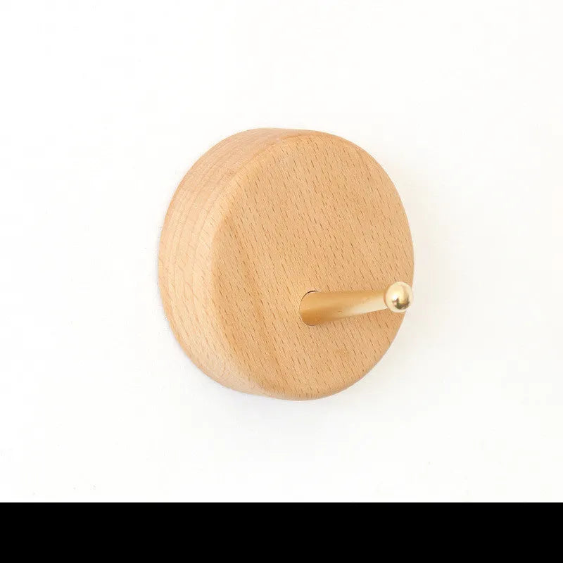 Beech wood adhesive wall hook with brass hardware in five shapes: round, capsule, oval, diamond, square