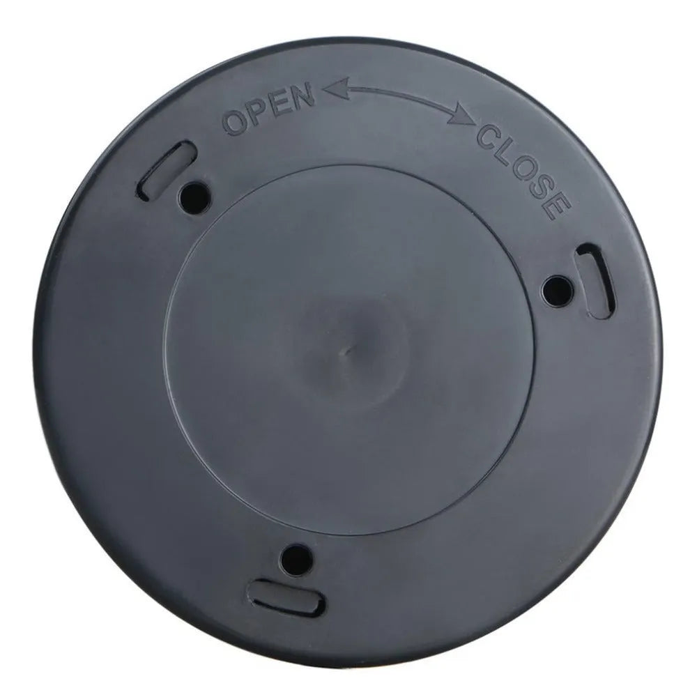 Silver circular battery-powered motion sensor night light on a surface.