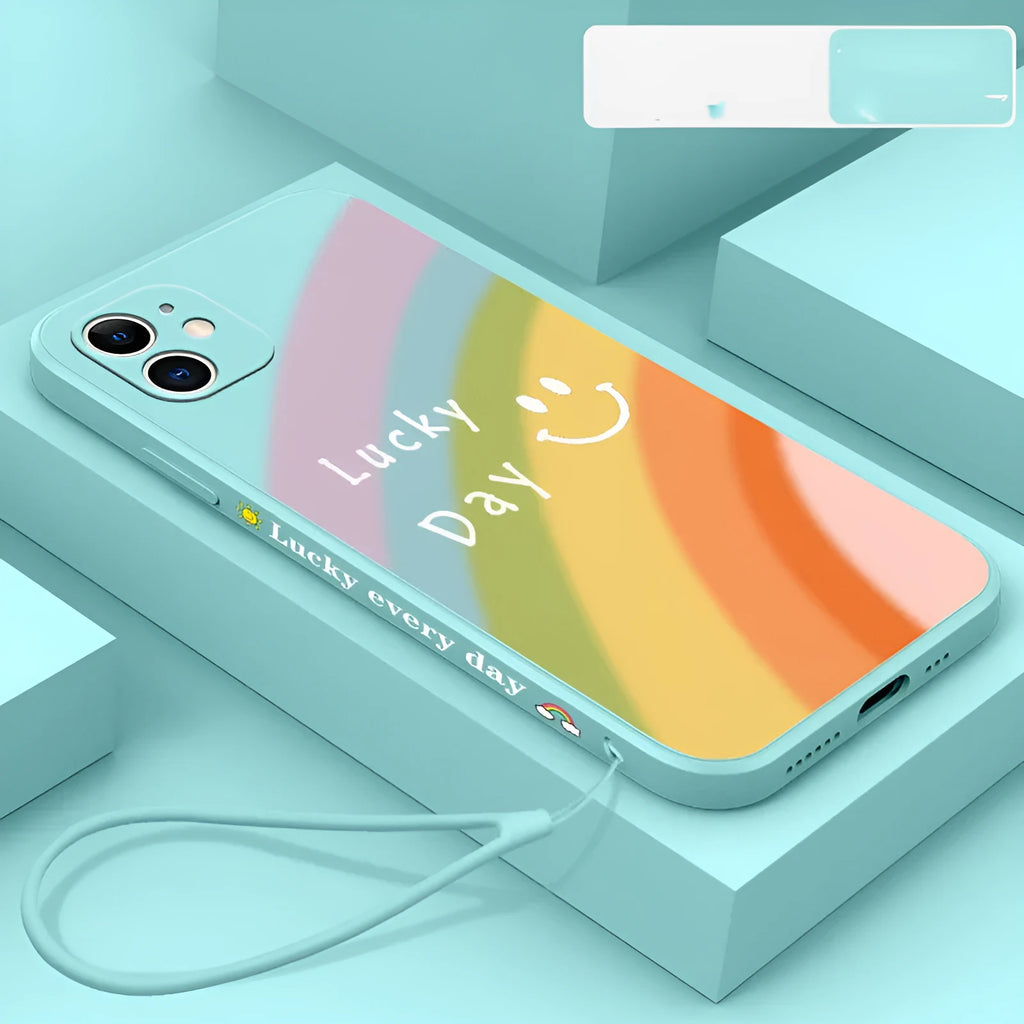 Rainbow smiley face design on a colourful silicone phone case for iPhone, showing blue, green, purple, and red colour options.