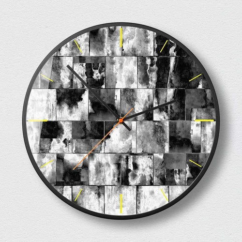Round abstract art wall clock in Mysterious Black with metal frame and glass face, showing silent sweep second hand.