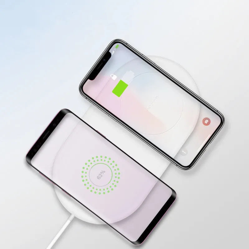 White dual wireless charging pad for two mobile phones with fast charging support
