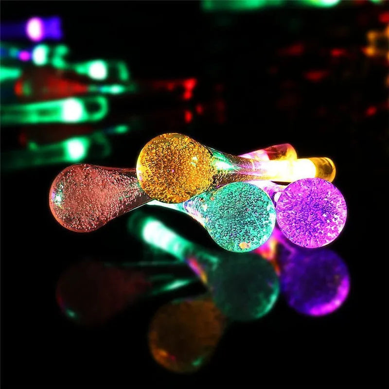 Solar-powered LED string lights with bubble drop pendants on 6.5 metre cable for outdoor garden decoration