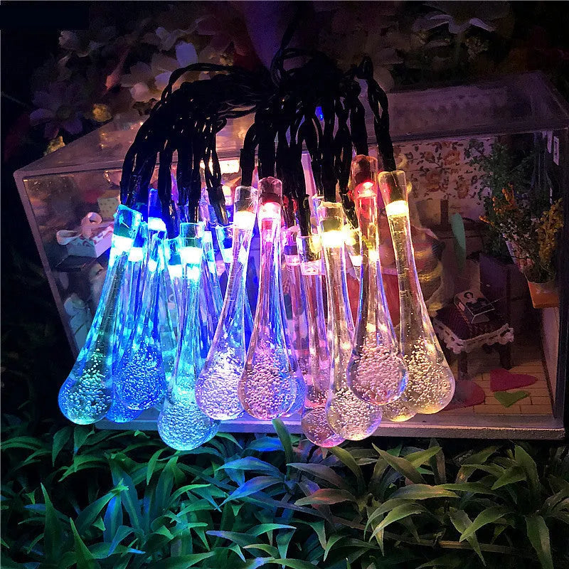 Solar-powered LED string lights with bubble drop pendants on 6.5 metre cable for outdoor garden decoration