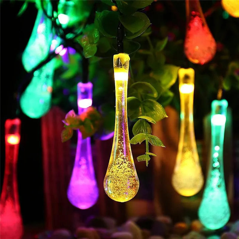 Solar-powered LED string lights with bubble drop pendants on 6.5 metre cable for outdoor garden decoration