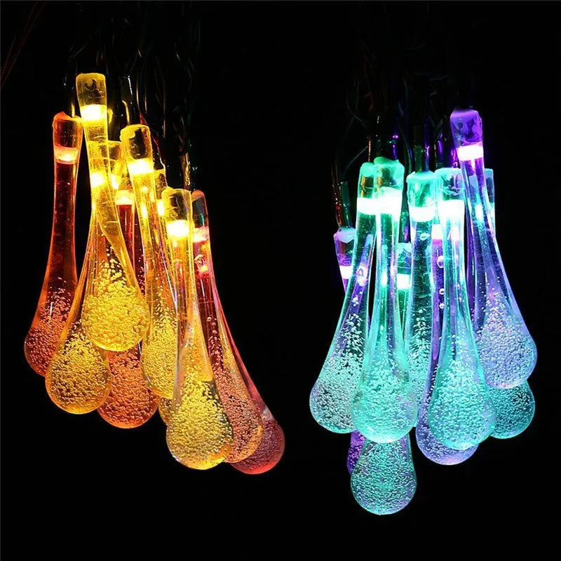 Solar-powered LED string lights with bubble drop pendants on 6.5 metre cable for outdoor garden decoration