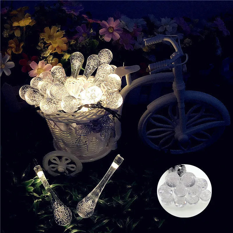 Solar-powered LED string lights with bubble drop pendants on 6.5 metre cable for outdoor garden decoration