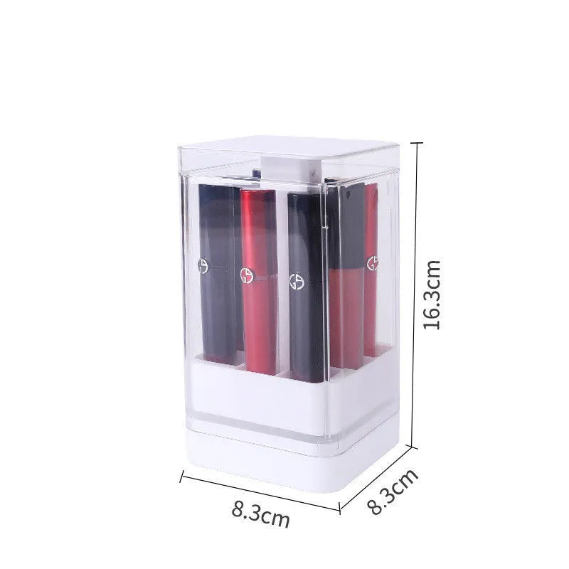 Pink press-lift lipstick storage box with dust cover open, showing 12 organised compartments.