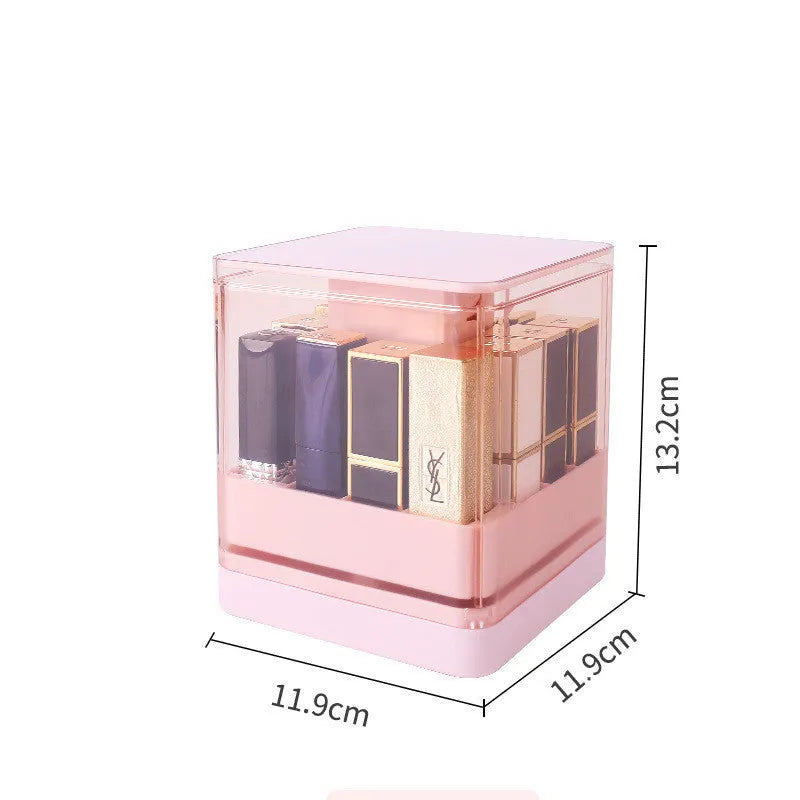 Pink press-lift lipstick storage box with dust cover open, showing 12 organised compartments.