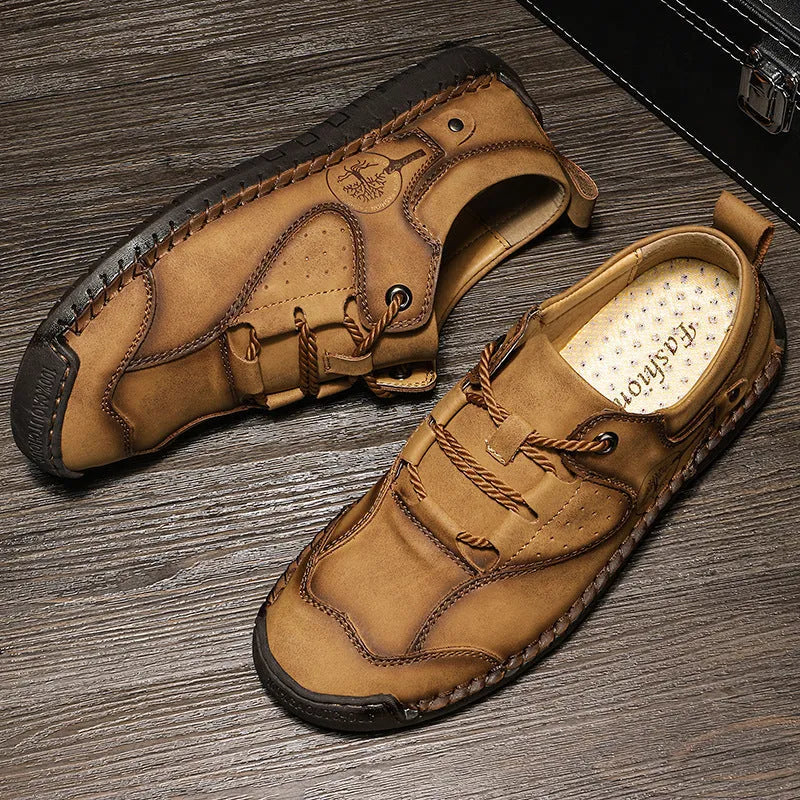 Men's black casual leather shoes with microfiber upper and round toe on a plain background