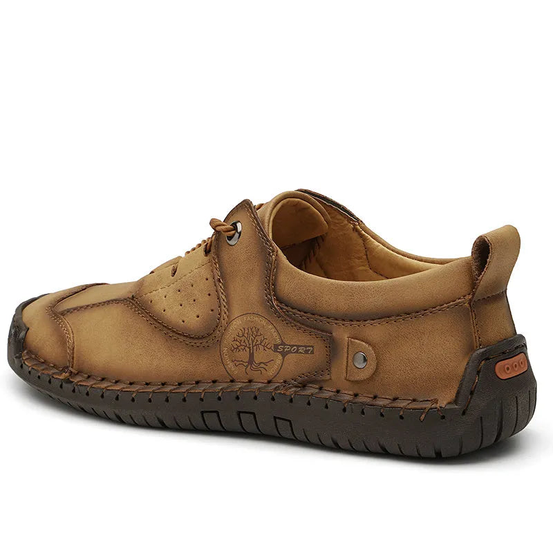 Men's black casual leather shoes with microfiber upper and round toe on a plain background
