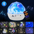 Starry sky projector lamp with plastic shade showing cosmos projection pattern on wall