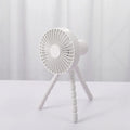 Small white desk fan with bending head on a black octopus tripod base