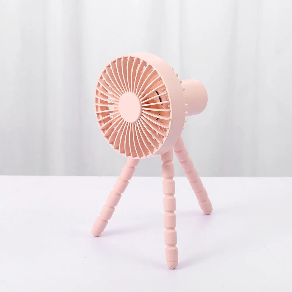 Small white desk fan with bending head on a black octopus tripod base