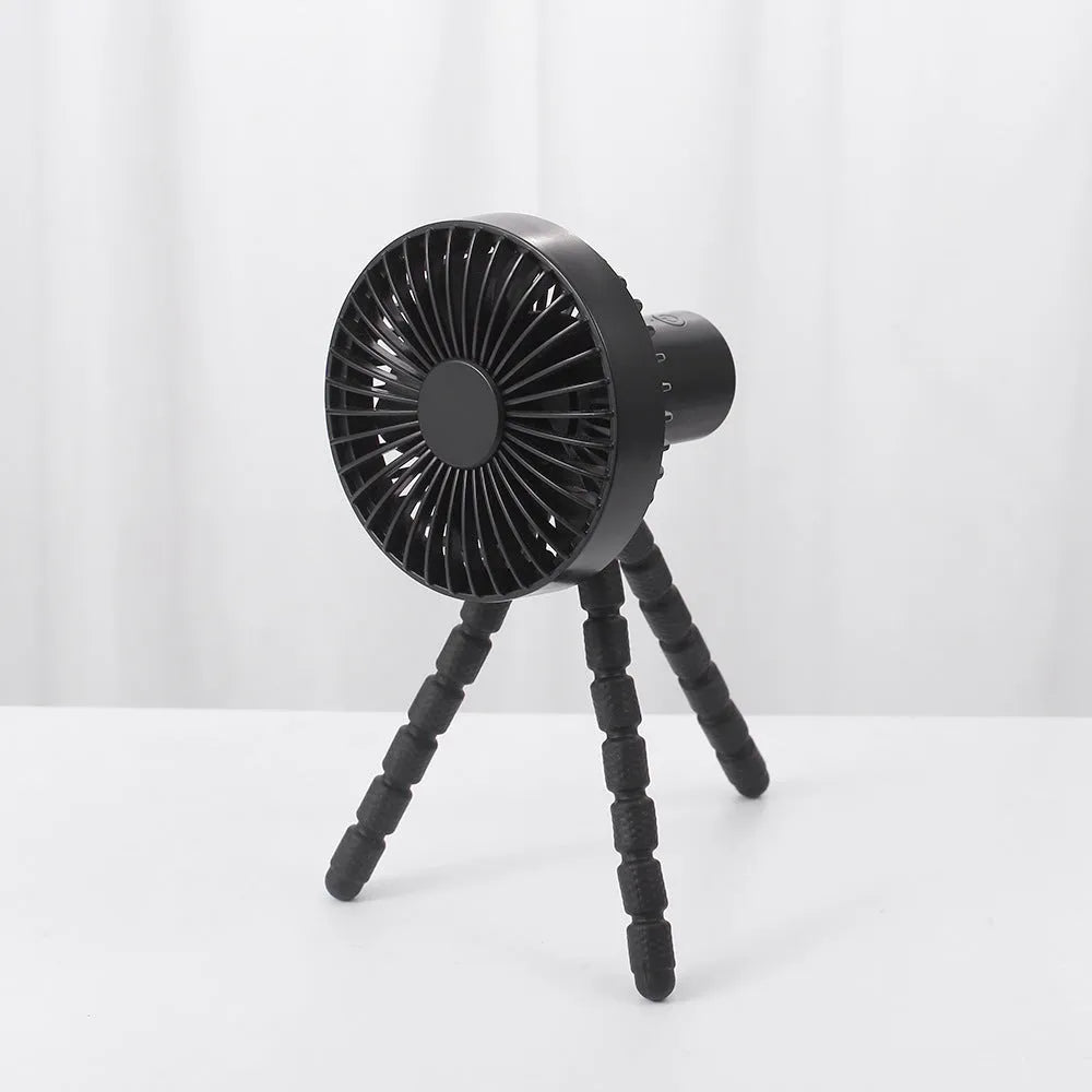 Small white desk fan with bending head on a black octopus tripod base