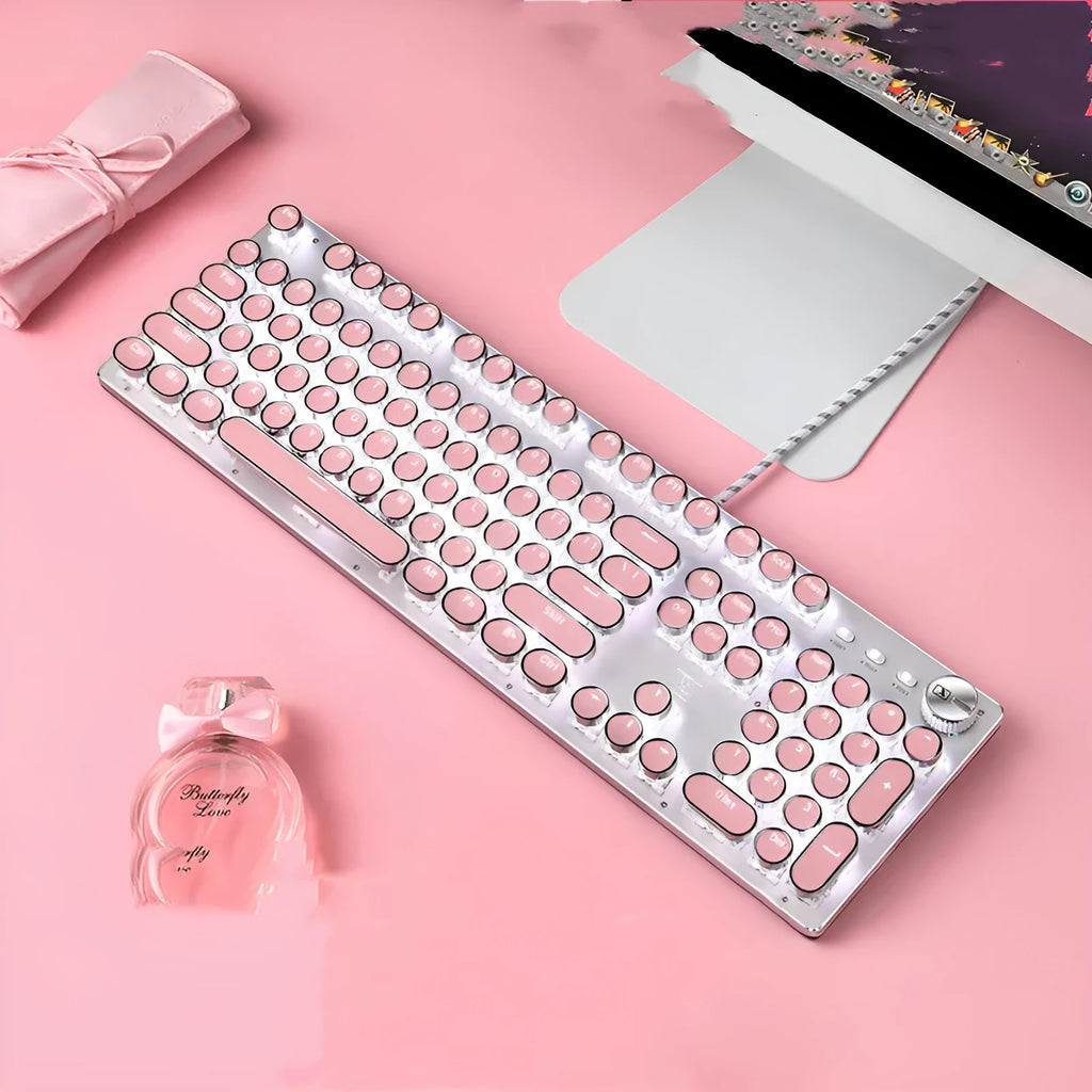 Silver and pink mechanical keyboard with white backlight and green switches next to matching wired mouse