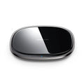Black or white 15W Qi wireless phone charger with zinc alloy body and glass top.