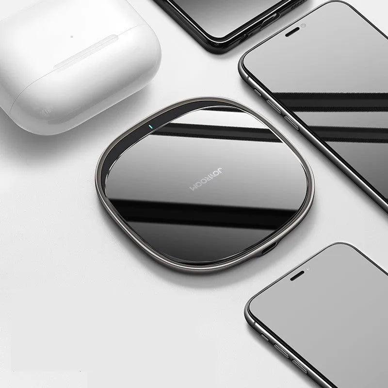 Black or white 15W Qi wireless phone charger with zinc alloy body and glass top.