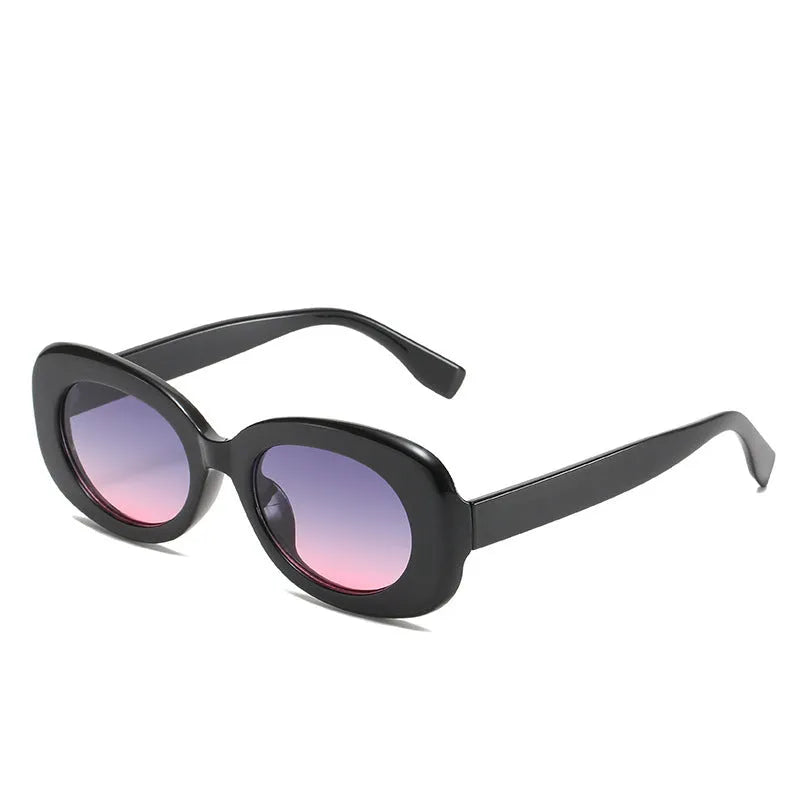 Oval fashion sunglasses for women with black PC frame and UV400 AC lenses