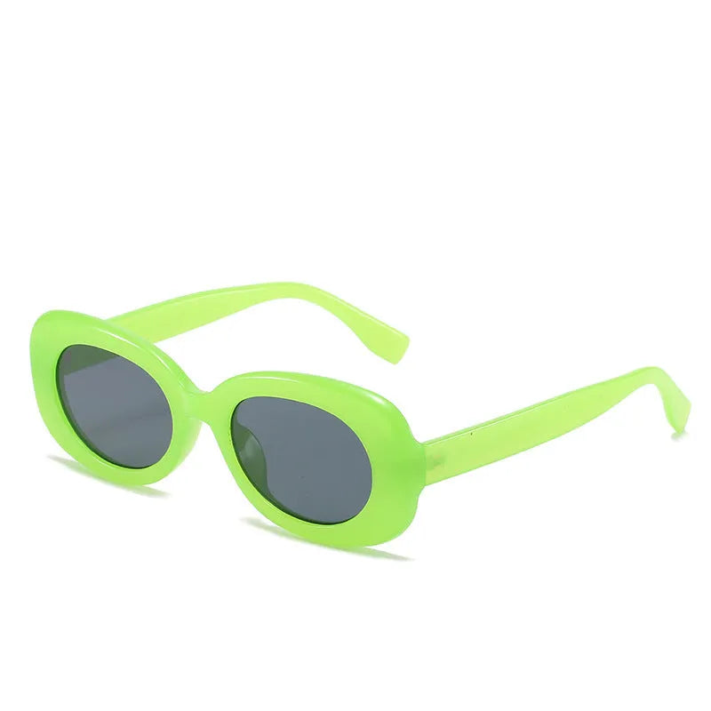 Oval fashion sunglasses for women with black PC frame and UV400 AC lenses