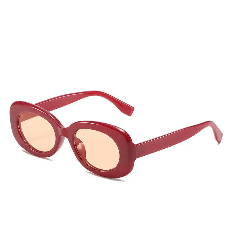 Oval fashion sunglasses for women with black PC frame and UV400 AC lenses