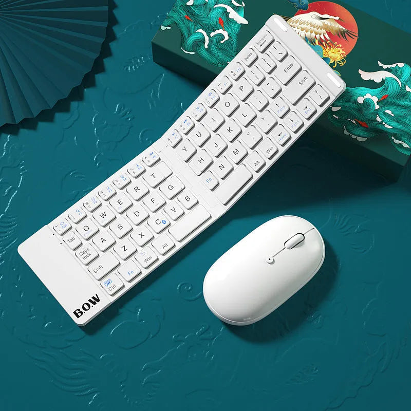 Folding Bluetooth keyboard and mouse set in elegant white, with full-sized keys and touchpad, folded for portability.