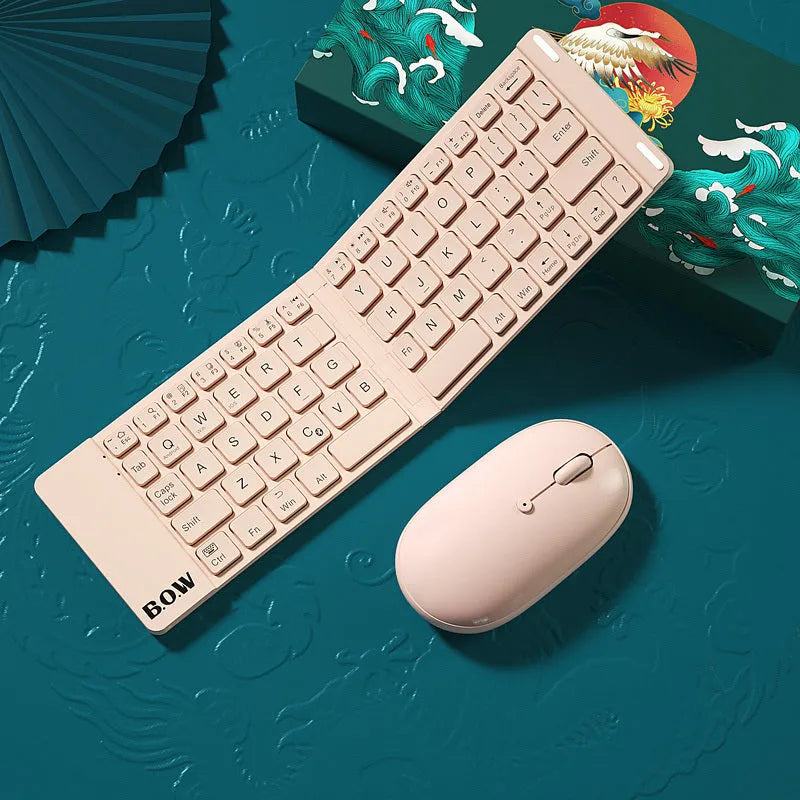 Folding Bluetooth keyboard and mouse set in elegant white, with full-sized keys and touchpad, folded for portability.