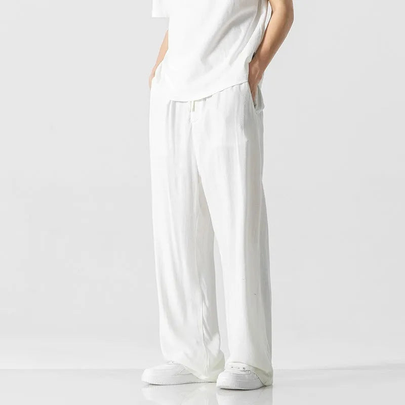 Men's cropped linen trousers in bamboo fibre with a loose straight-leg fit and drawstring waist.
